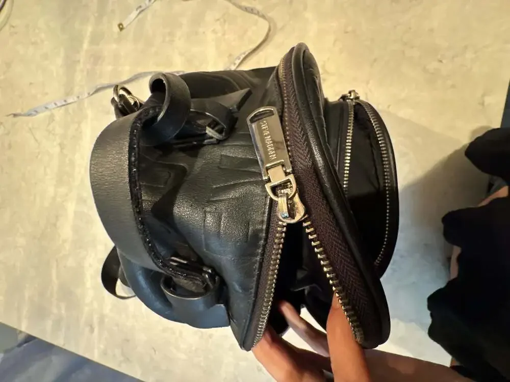 Steve Madden Black Mini Backpack Purse with Embossed Logo and Tassel